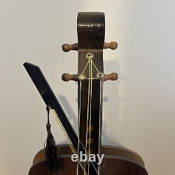 Horloge vintage en forme de violon