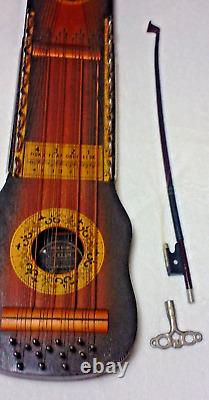 Ukelin en bois ancien vintage par Bosstone Co. Combinaison de violon/ukulélé avec archet